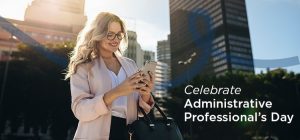 Administrative Professional walking in the city using her phone