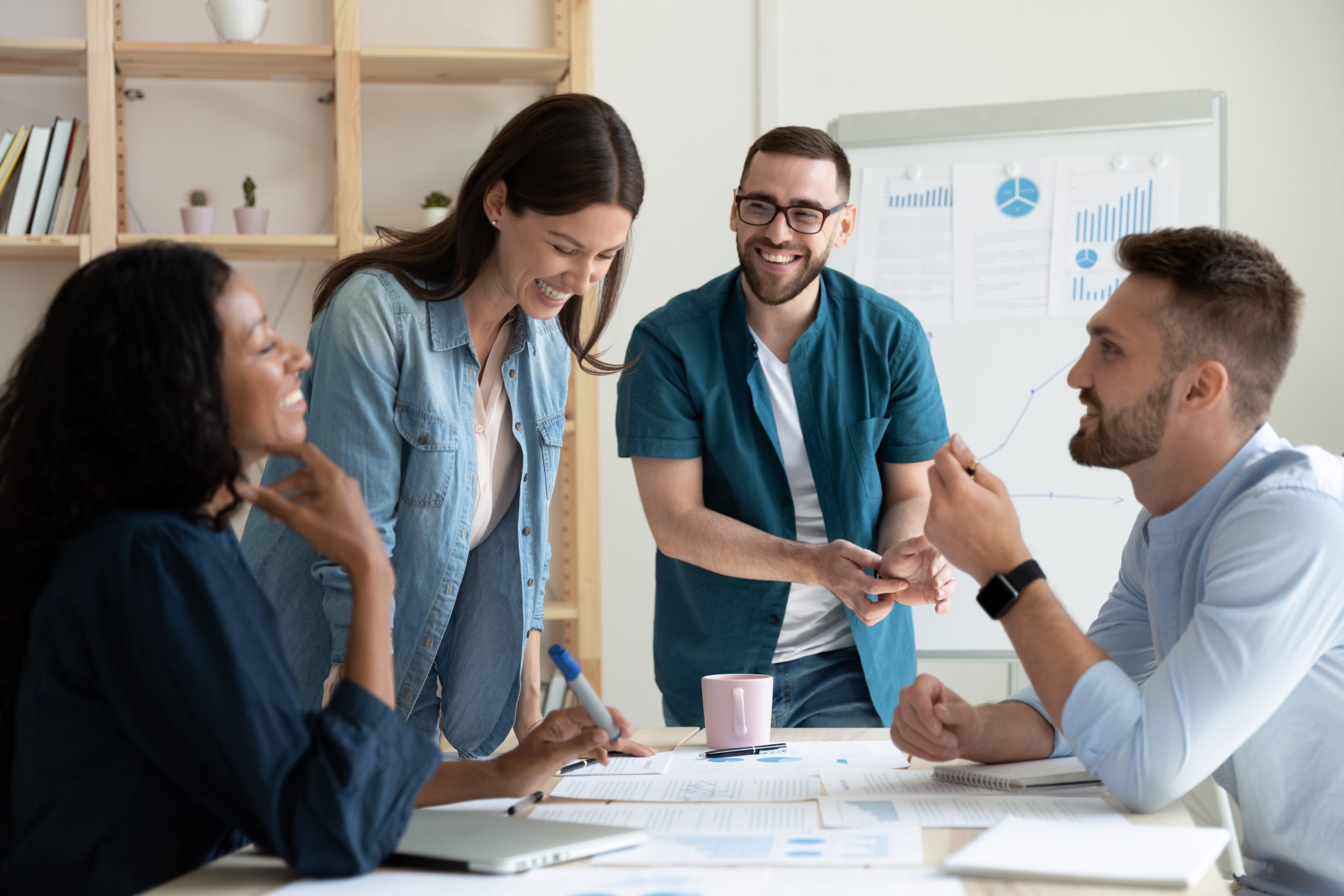 Smiling,Diverse,Colleagues,Gather,In,Boardroom,Brainstorm,Discuss,Financial,Statistics