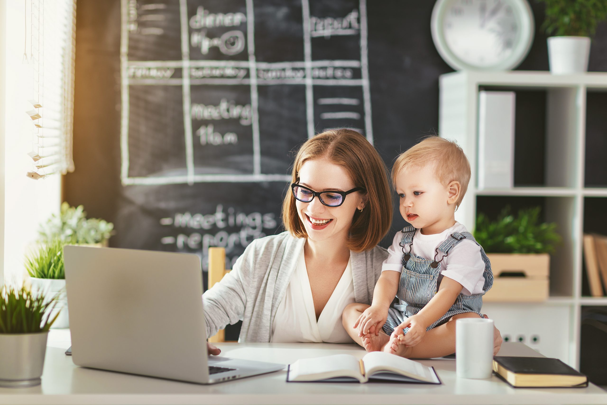 Businesswoman,Mother,Woman,With,A,Toddler,Working,At,The,Computer Businesswoman,Mother,Woman,With,A,Toddler,Working,At,The,Computer