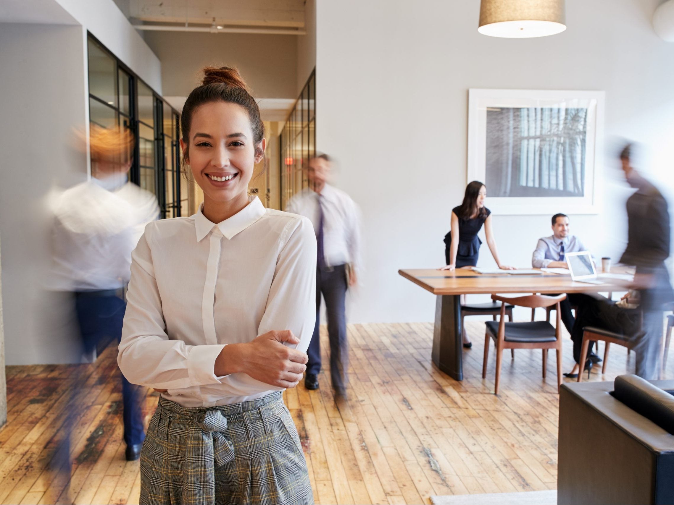 Portrait,Of,Young,White,Woman,In,A,Busy,Modern,Workplace