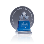Round crystal award with 3 stars stacked on top of a blue piece of crystal