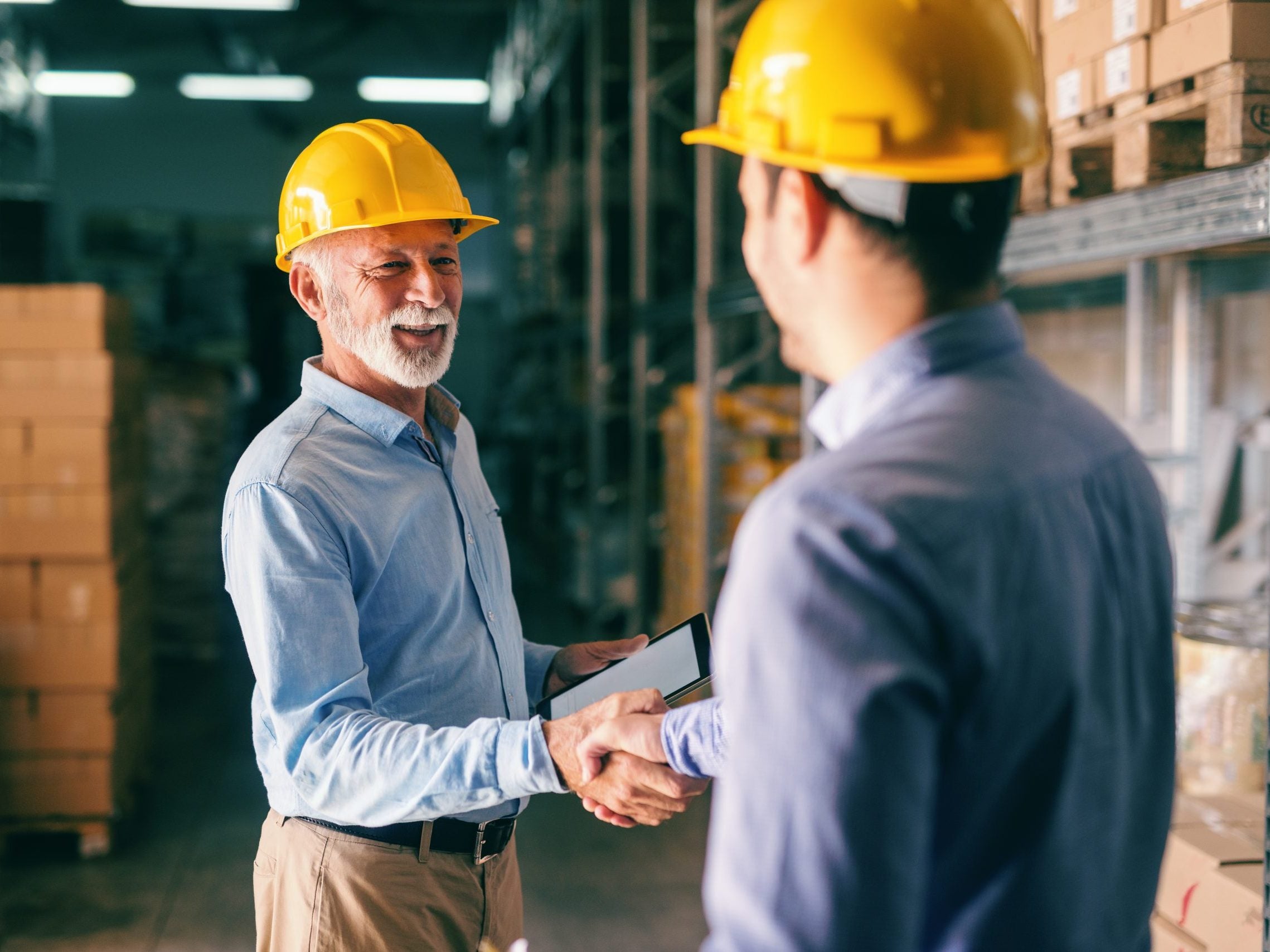 Two,Businessmen,Shaking,Hands,For,Successful,Business,While,Standing,In