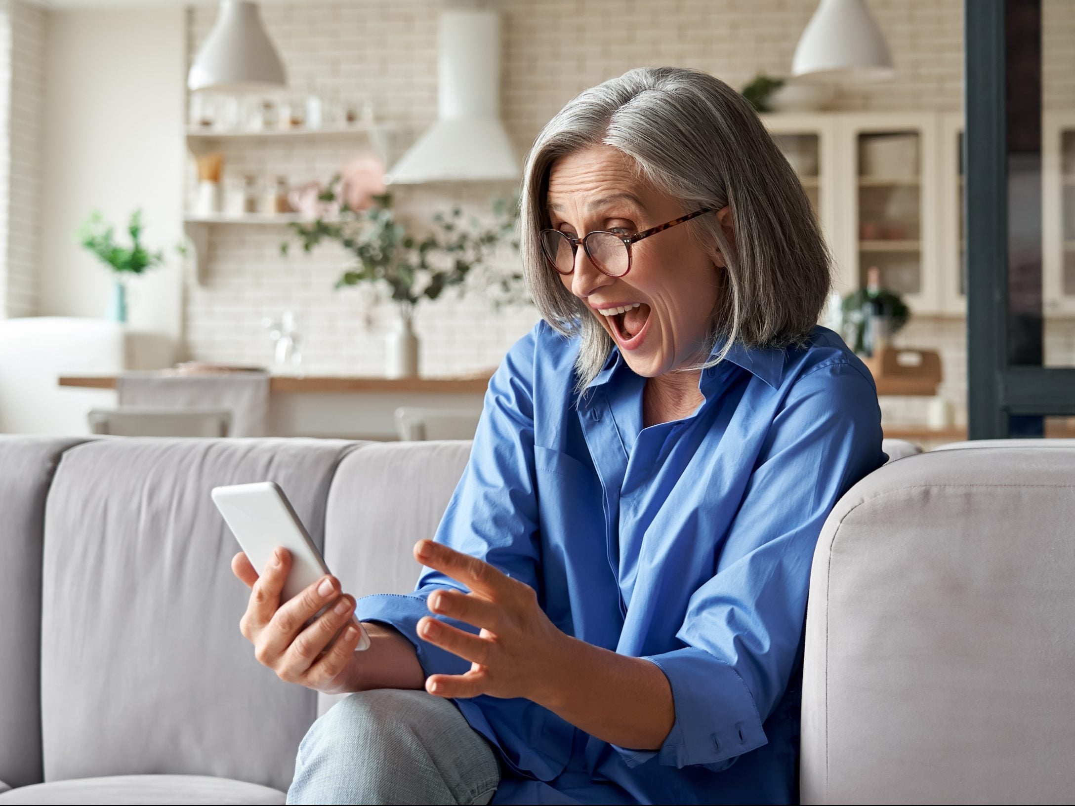 Amazed,Happy,Mature,Older,60s,Woman,,Excited,Customer,Holding,Smartphone Amazed,Happy,Mature,Older,60s,Woman,,Excited,Customer,Holding,Smartphone