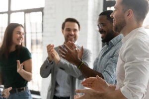 employees clapping reward vs award