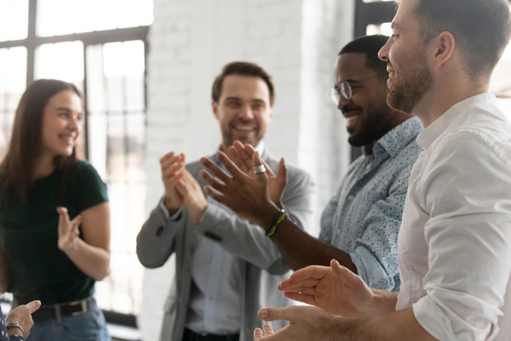 employees clapping reward vs award