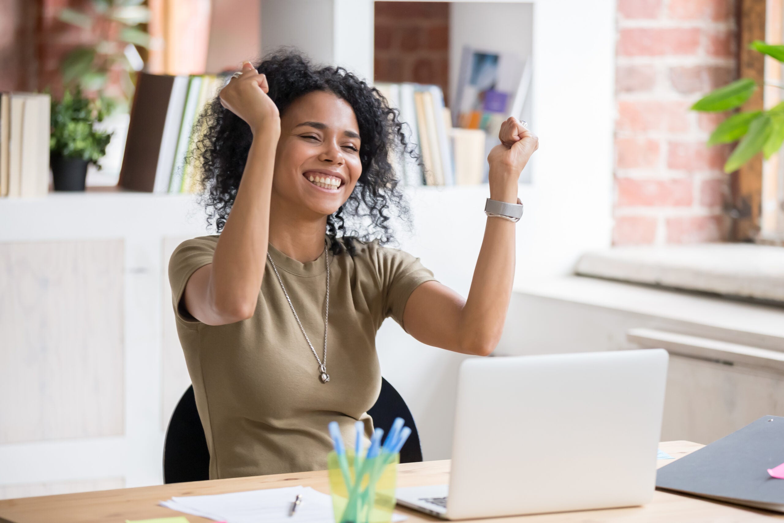 Woman Celebrating in Office