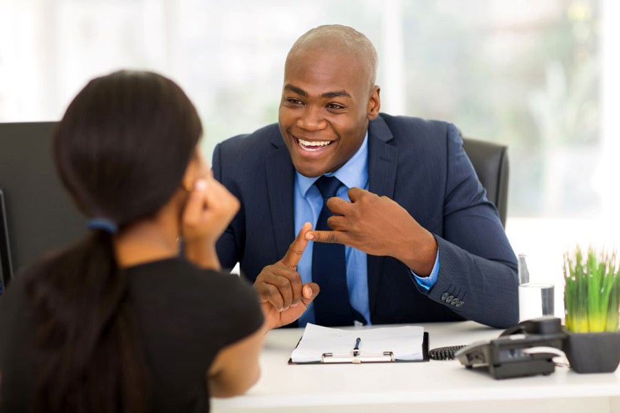 A motivational manager talking with an engaged employee