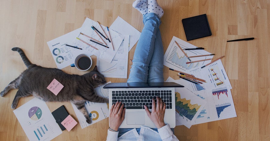 Employee working from home on the floor with car