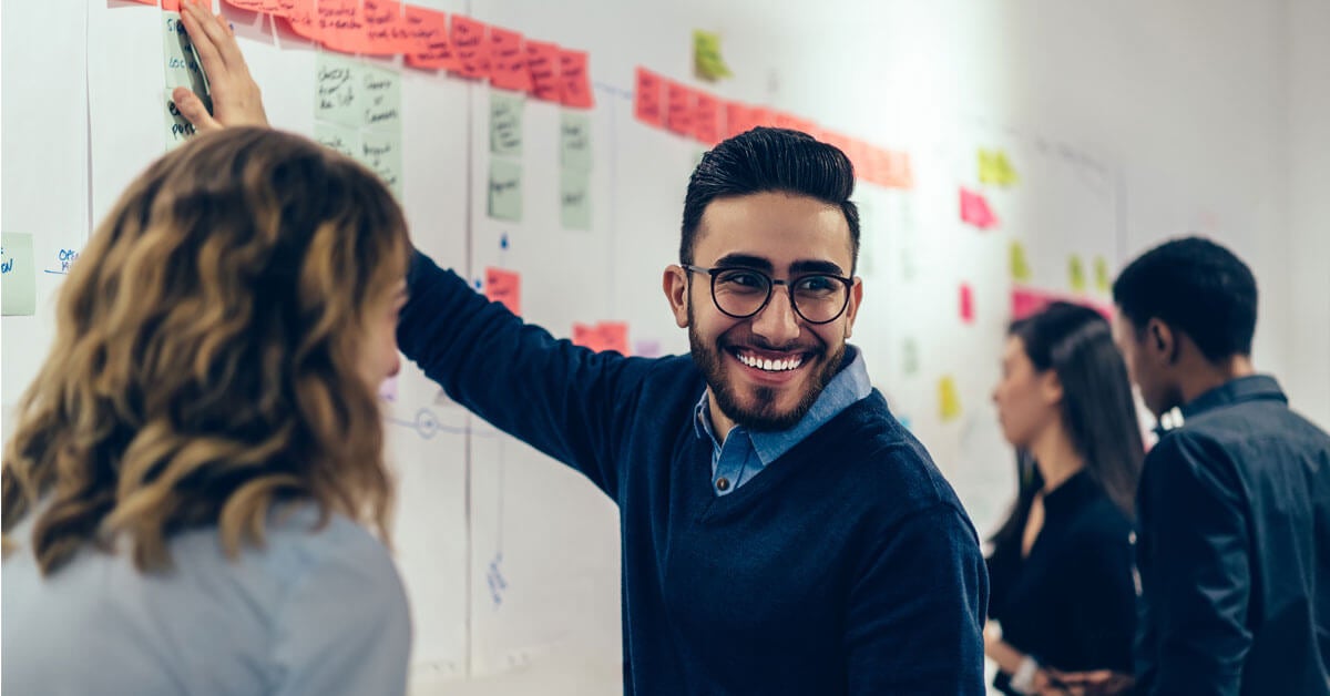 Happy Man with Glasses Presenting