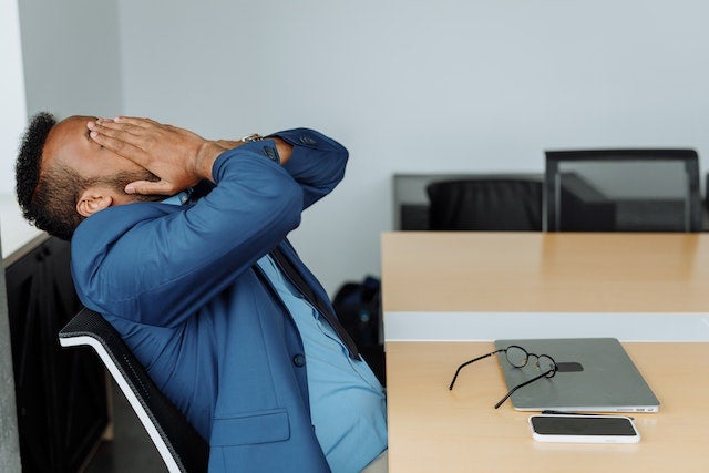 frustrated man working at desk