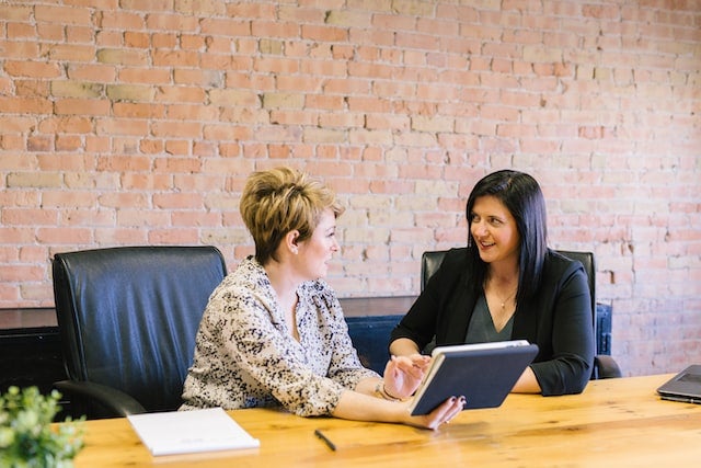 two employees talking to each other