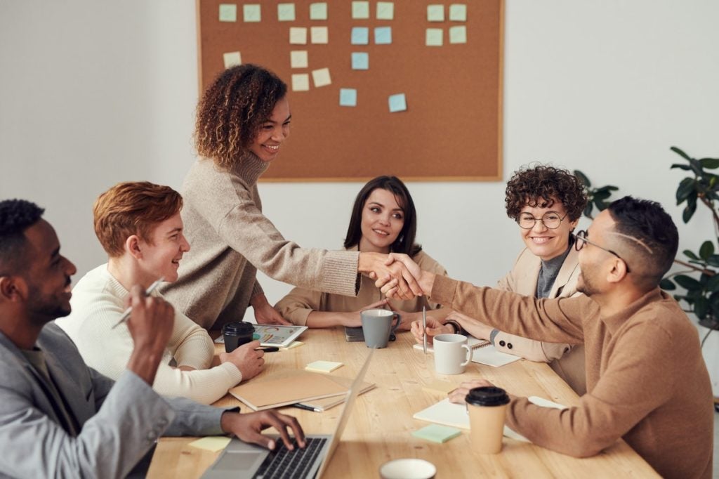 work colleagues shaking hands