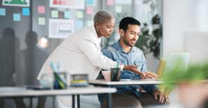 Man and woman working together at desk