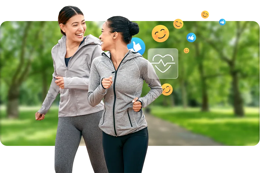 Two women in gray zip ups are jogging together in a green park. There are several happy emojis around them, signifying team engagement for a group activity.