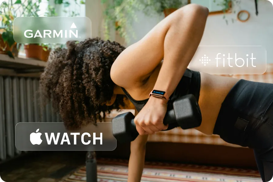 A woman is exercising with weights in a living space, and several brand logos are around her, including Garmin, Apple Watch, and Fitbit.