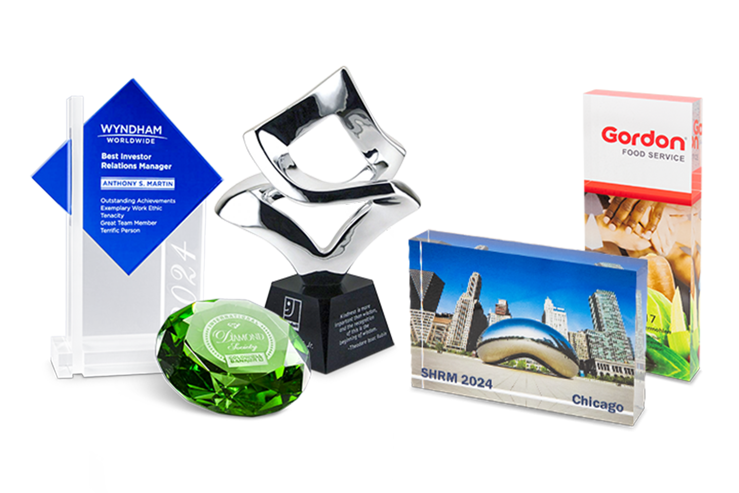 An assortment of acrylic, metal, and crystal trophies