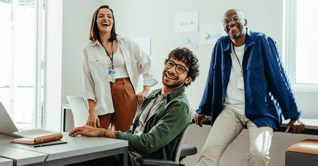 Happy group of three employees