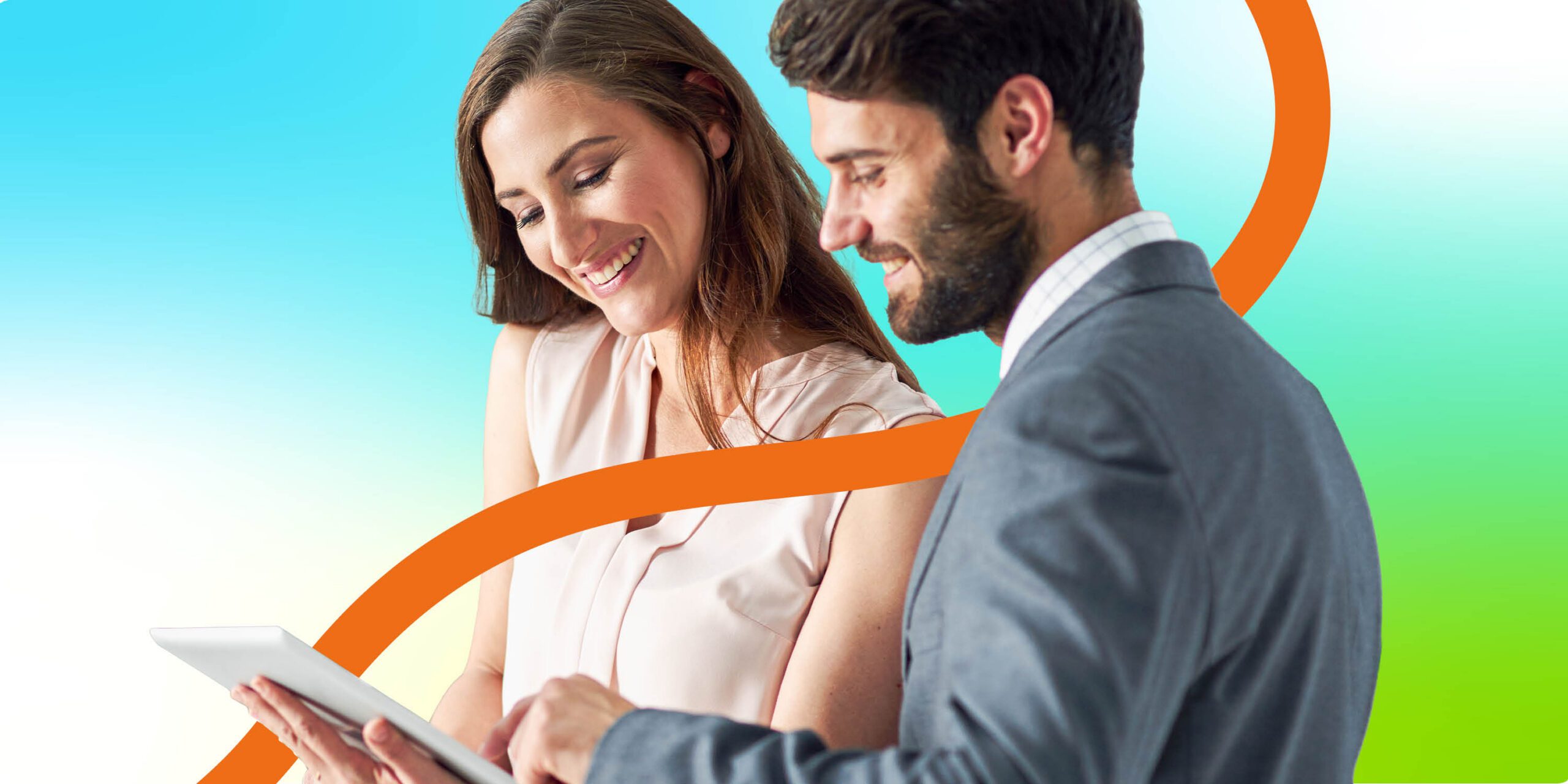 Two business people looking at data on a tablet