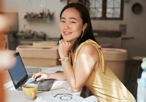 4-Day-Work-Week happy woman at home desk
