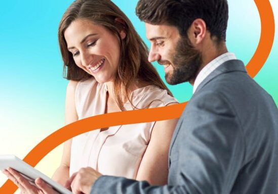 Two business people looking at data on a tablet